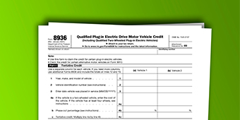 A tax form is sitting on top of a green table