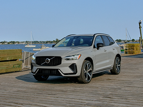 Gray Volvo XC60 plug-in hybrid is parked on a fishing dock