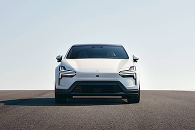 Polestar 4 on an open road beneath a vast blue sky