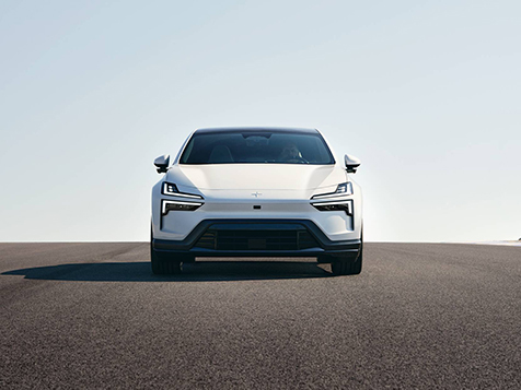 Polestar 4 on an open road beneath a vast blue sky