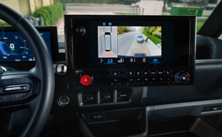 Front interior of a Chevrolet BrightDrop with a rear view camera display shown