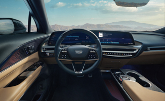 Cadillac LYRIQ interior featuring a wide, curved digital display