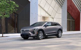 Gray Cadillac OPTIQ on a modern urban street