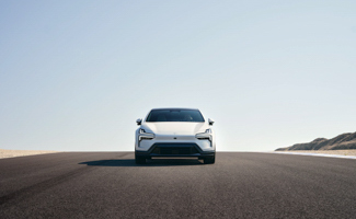 Polestar 4 on an open road beneath a vast blue sky