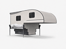 A modern slide-in truck camper